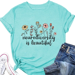 Flat lay of blue Neurodiversity is Beautiful t-shirt with floral print and denim shorts