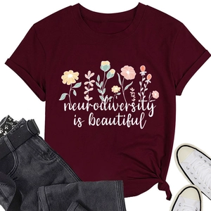 Detail of burgundy floral t-shirt with neurodiversity text and stylish front knot hem