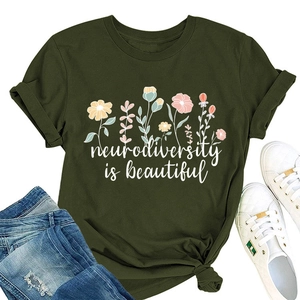 Detail of floral print and 'neurodiversity is beautiful' text on a green cotton T-shirt