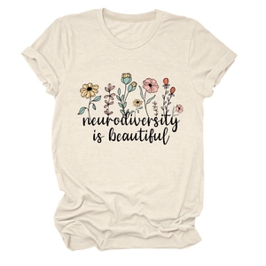Detail of beige cotton t-shirt with floral print and Neurodiversity is beautiful text