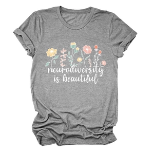 Close-up of grey t-shirt featuring colorful floral art and Neurodiversity slogan