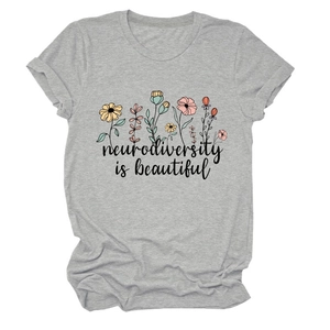 Detailed close-up of gray crew neck T-shirt with neurodiversity is beautiful flower print
