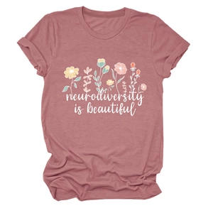 Detail of pink cotton T-shirt with flower print and Neurodiversity is beautiful text