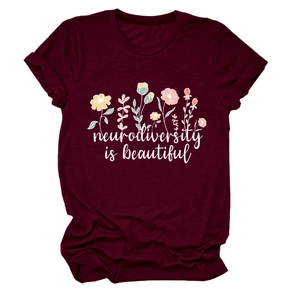 Detail of burgundy t-shirt with 'neurodiversity is beautiful' text and floral print