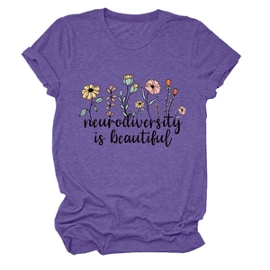 Detail of purple t-shirt showing colorful floral print and neurodiversity is beautiful text