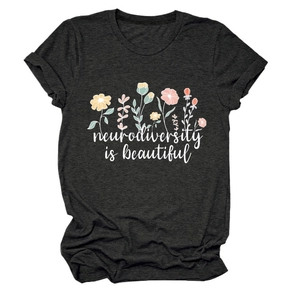 Close-up of floral design and 'neurodiversity is beautiful' text on charcoal grey T-shirt