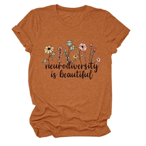 Detail of neurodiversity is beautiful print and rolled sleeves on rust red t-shirt