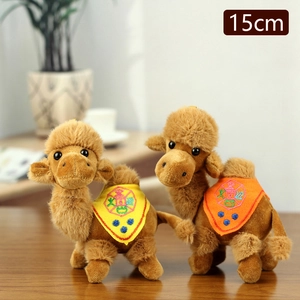 Cute 15cm camel plush keychain toy with colorful embroidered saddle on wooden surface