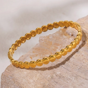 Polished 18K gold-plated beaded bangle with a minimalist design for women