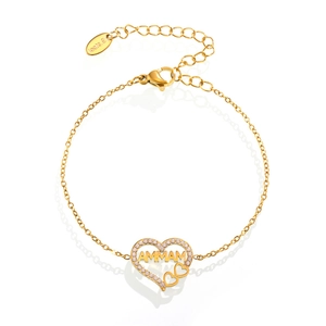 Bracelet MAMMA en acier inoxydable doré avec cœur serti de zircons sur fond blanc épuré