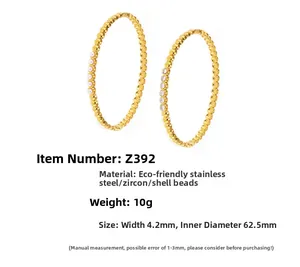 Detailed view of 4.2mm gold stainless steel bangle with zircon and shell inlay