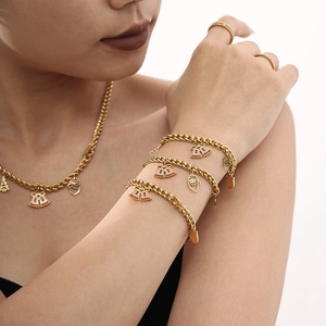 Christmas jewelry set with gold bell necklaces, bracelets and rings for festive fashion