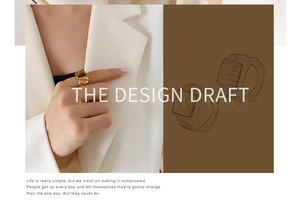 Detail of a square tiger eye stone ring with a textured gold band on a finger