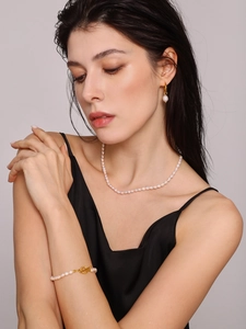 Close-up of elegant freshwater pearl jewelry set with necklace, bracelet and earrings