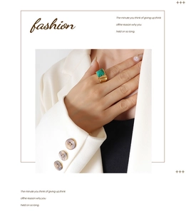 Detail of square green malachite stone ring with heavy gold textured band on model