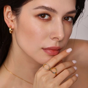Adjustable hollow stainless steel ring with colorful zircon stones on female model