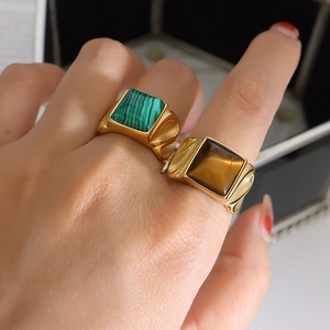 Vintage stainless steel gold rings with square malachite and tiger eye stones on fingers
