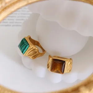 Vintage gold-plated square rings featuring green malachite and brown tiger eye stones