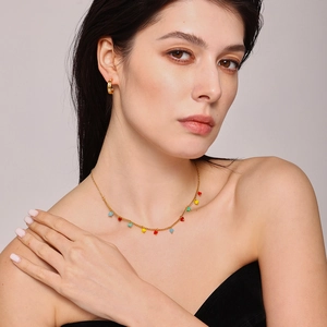 Gold stainless steel necklace with multi-colored heart pendants and crystal hoop earrings