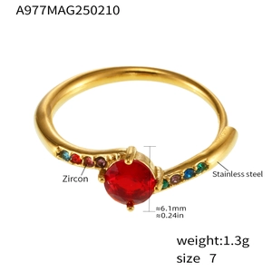 Macro detail of gold-plated stainless steel ring with 6.1mm red zircon and side stones