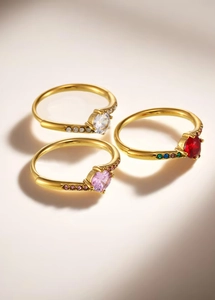 Detailed view of three 18k gold plated stainless steel rings with colorful zircon stones