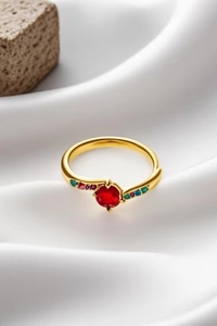 Detail of 18k gold plated ring featuring a red gemstone and multi-color zircon stones
