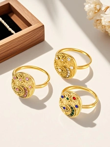 Detail of bohemian gold rings with star moon symbols and colorful 5A zircon inlay