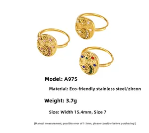 Detail view of gold-plated stainless steel evil eye rings with star and moon zircon inlays