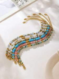 Detailed view of colorful natural stone beaded bracelets with gold stainless steel clasps