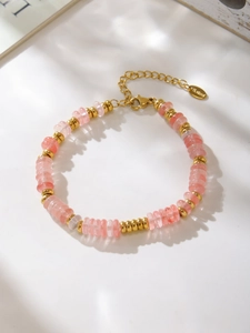 Detail of pink natural stone bead bracelet with 18k gold-plated stainless steel clasp