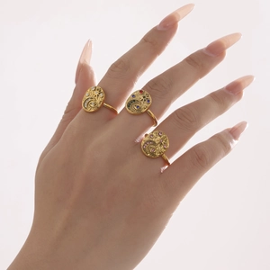 Three-piece gold ring set with celestial moon, star and evil eye motifs and colorful zircon