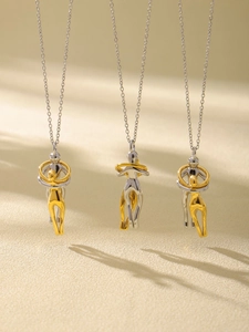 Detail of detachable gold and silver plated necklaces with abstract hugging pendants