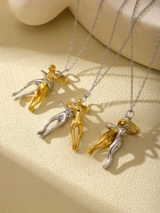 Close-up of the detachable gold and silver hugging pendants on titanium steel chains