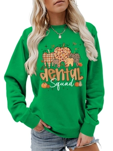 Detail of emerald green long sleeve sweatshirt with creative Dental Squad pumpkin graphic