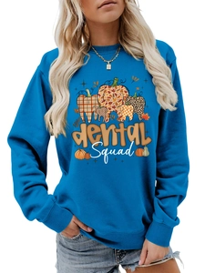 Detail of blue crewneck sweatshirt featuring a dental squad pumpkin graphic and ribbed cuffs