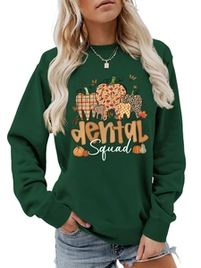 Detail of Dental Squad graphic print on dark green long sleeve sweatshirt for women
