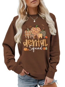 Detailed view of dental squad pumpkin graphic on brown crewneck sweatshirt for dentists