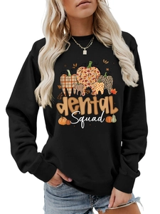 Detail of Dental Squad graphic sweatshirt with pumpkin teeth print and autumn textures
