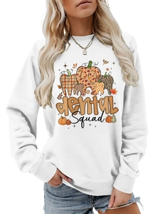 Close-up of dental squad typography and leopard print pumpkin design on white sweatshirt