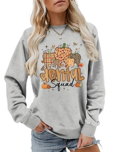 Close-up of Dental Squad pumpkin graphic on a light grey crewneck sweatshirt