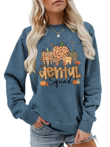 Detail of ribbed cuffs and dental squad graphic print on blue crewneck sweatshirt