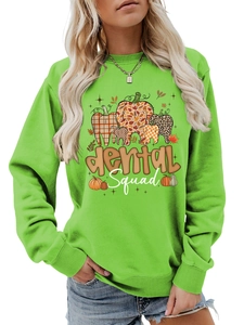Detail of the Dental Squad print on a fluorescent green crewneck sweatshirt for women