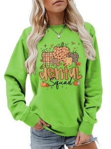 Detail of Dental Squad graphic print on bright green long sleeve autumn sweatshirt
