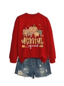 Flat lay of red Dental Squad sweatshirt with patterned tooth print and denim shorts
