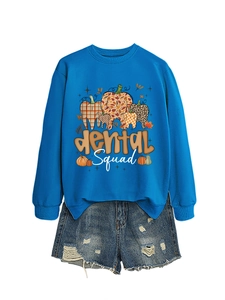 Detail of royal blue long sleeve dental squad sweatshirt with pumpkin tooth print design