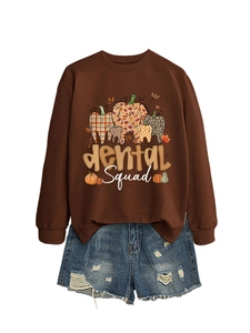 Detail of Dental Squad graphic sweatshirt in dark brown paired with blue denim shorts