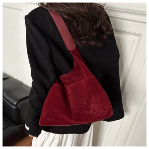 Deep burgundy suede tote bag shown on model with chic fall outfit for casual daily use