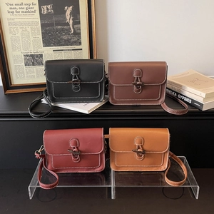 Retro student satchel bag with horn buckle and contrast stitching in four vintage colors