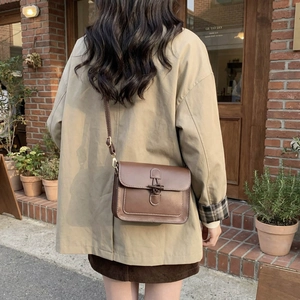 Vintage brown oil wax leather tote bag with contrast stitching and flip cover for women
