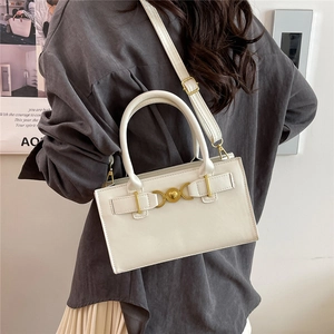 Minimalist cream white women's handbag with gold heart buckle and adjustable strap